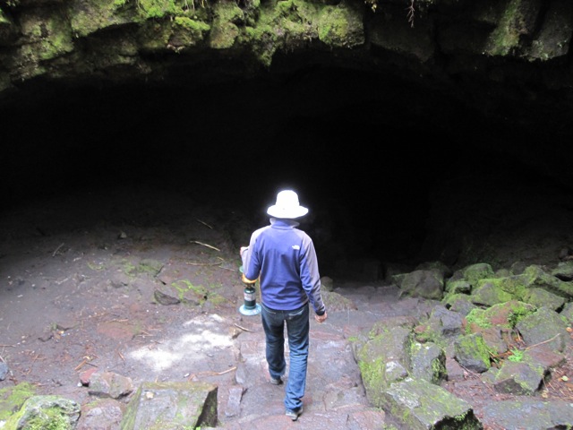 Rob with the lantern at the cave entrance!